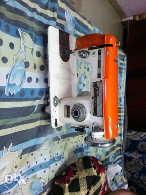 Orange And White Sewing Machine