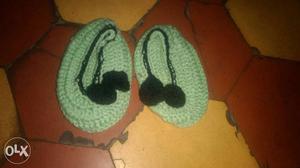 Pair Of Green And Black Knitted Shoes