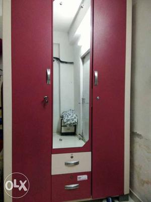 Red Wooden Closet With Mirror