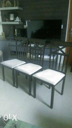 Three Rubber Wooden Base White cusion Chairs