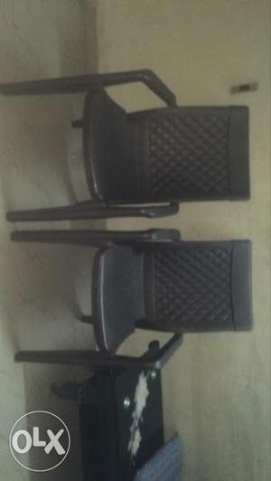 Two Black Plastic Armchairs
