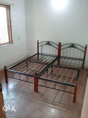 Two Black-and-red Metal Bed Frames