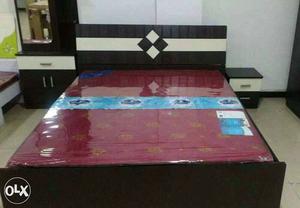 Black Wooden Bed And Red Mattress