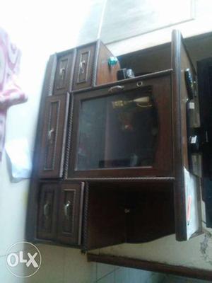 Brown Wooden Television Stand And Flat Screen Televison