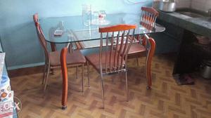 Dining table with four chairs in good condition