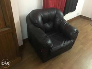 Leather brown recliner chair; front bottom needs