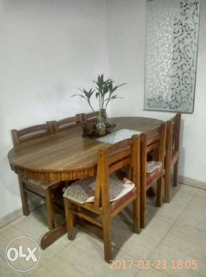 Six seaters 100% wooden dining with new condion