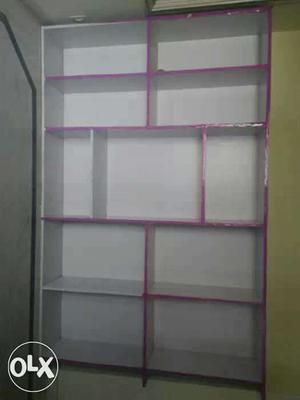 White And Pink Wooden Symmetrical Shelf