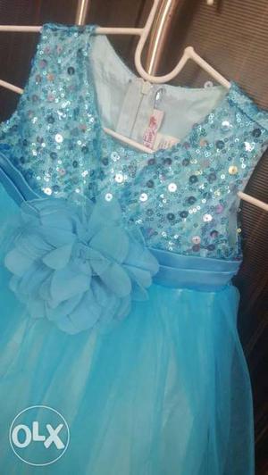 Baby blue sequined dress in brand new condition.