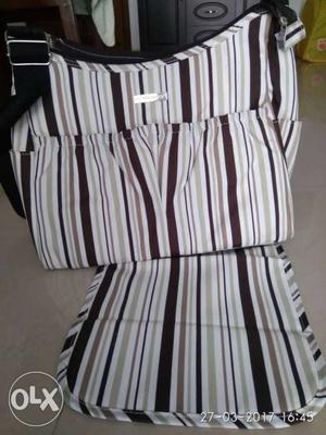 Baby diaper and nursery bag with diaper changing