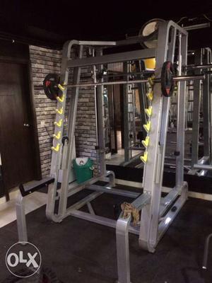 Black And Silver Barbell And Gray Steel Gym Equipment