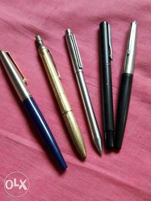 Five old pens: three Parker ink pens, one Zebra