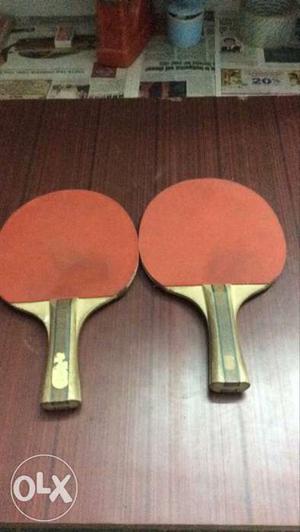 Two Brown Handled Table Tennis Racket