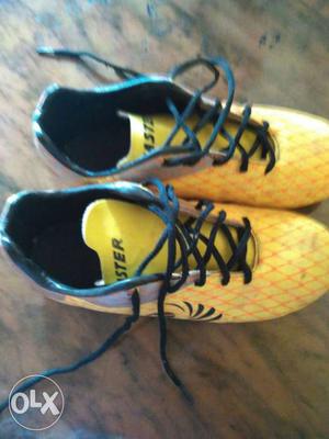 Yellow-and-black Soccer Cleats