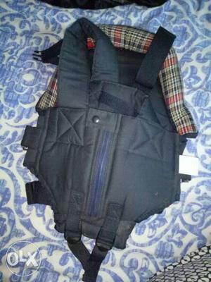Baby carrier in royal blue colour and checked