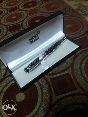 Black And Silver Wind Instrument In Box