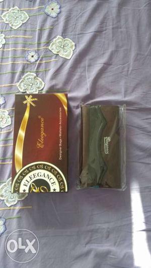 Brown And Black Leather Wallet And Box