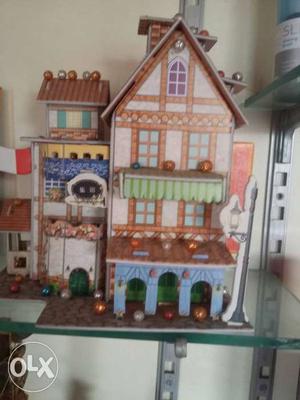 Brown And Green Wooden Dollhouse