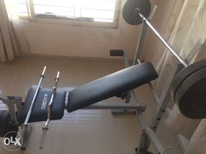 Inclined-Flat bench press with bar and weights,