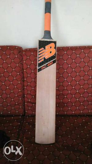 Orange And Brown New Balance Cricket Bat