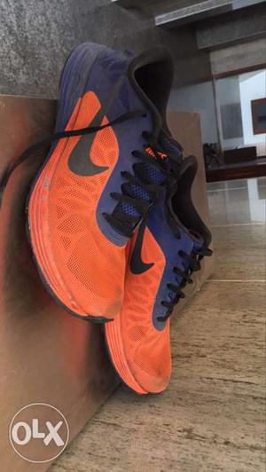 Pair Of Orange-and-blue Nike Mid Top Sneakers
