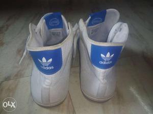 Pair Of Silver-and-blue Adidas High Top Sneakers
