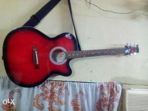 Red, Brown And Black Acoustic Guitar
