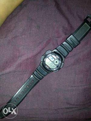 Round Digital Watch With Black Rubber Strap