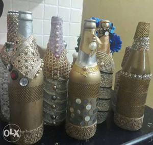 Six Brown And Grey Decorative Bottles