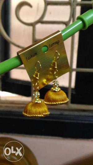 Two Gold Jhumka Earrings