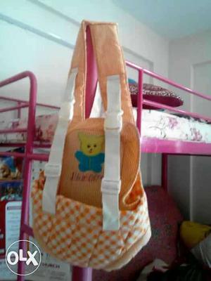 Baby's Orange And White Carrier