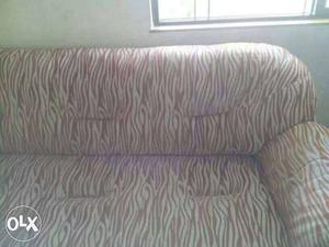 Brown And White Cushioned Couch