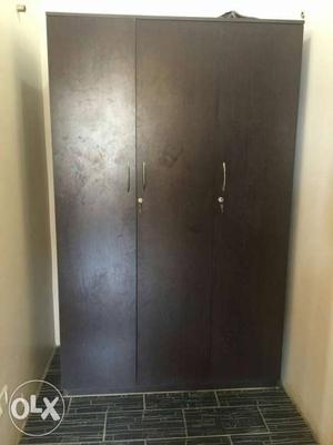 Wooden 3 door cupboard sparingly used and in very good