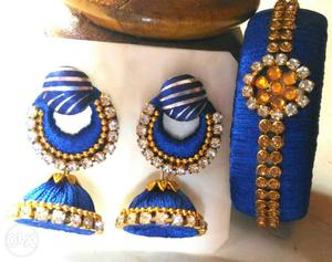 A pair of new blue silk thread earings and a