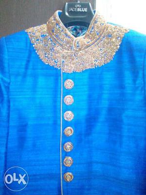 Jade Blue. Blue sherwani for Bride