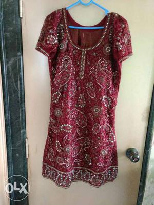 Maroon coloured heavy party dress Condition is