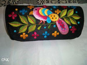 New black embroidered clutch with good storing space