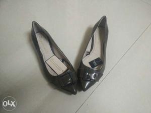 Pair Of Black Leather Pointy Buckled Flat Shoes