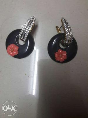 Pair Of Black-and-orange Floral Earrings