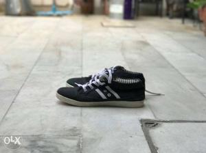 Pair Of Black-and-white Laced Up Low Top Sneakers