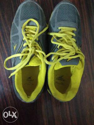 Pair Of Gray-and-yellow Shoes