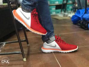 Pair Of Red-white-orange Nike Low Top Sneakers