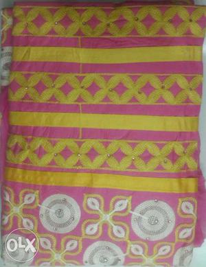 Pink And Yellow Textile dress material