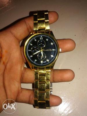 Round Gold Chronograph Watch call this number