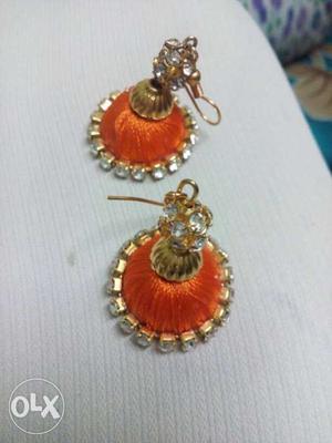 Two Gold-and-orange Jhumka Earrings