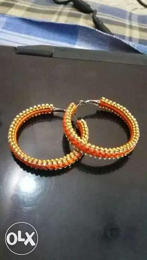 Two pairs of Orange Ear rings