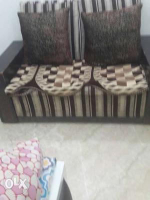 Brown And Black Loveseat