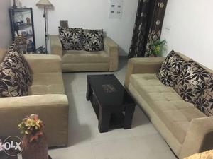 Seven seater sofa set with cushions for sale.