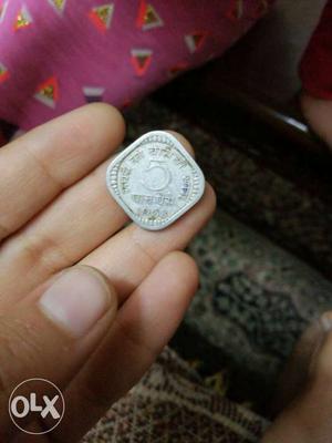 An antique  paise coin.