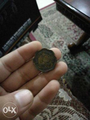 An antique  paise coin toss